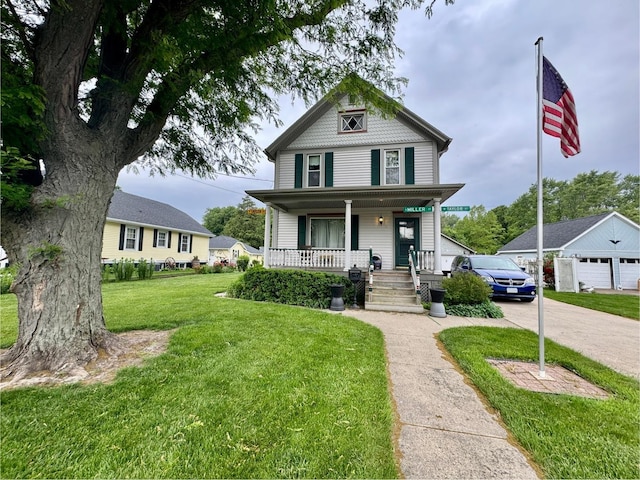 236 S Randolph St, Princeton, IL 61356 - victorian house featuring a porch, a front lawn, and driveway