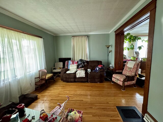 236 S Randolph St, Princeton, IL 61356 - dining room with a chandelier, wood finished floors, crown molding, and an ornate ceiling