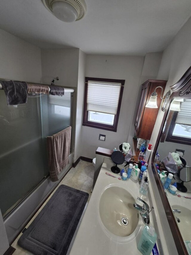 236 S Randolph St, Princeton, IL 61356 - bedroom featuring light wood-style floors, an ornate ceiling, and baseboards