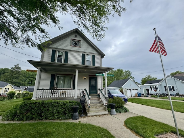236 S Randolph St, Princeton, IL 61356 - victorian house with a porch, a front yard, and a garage