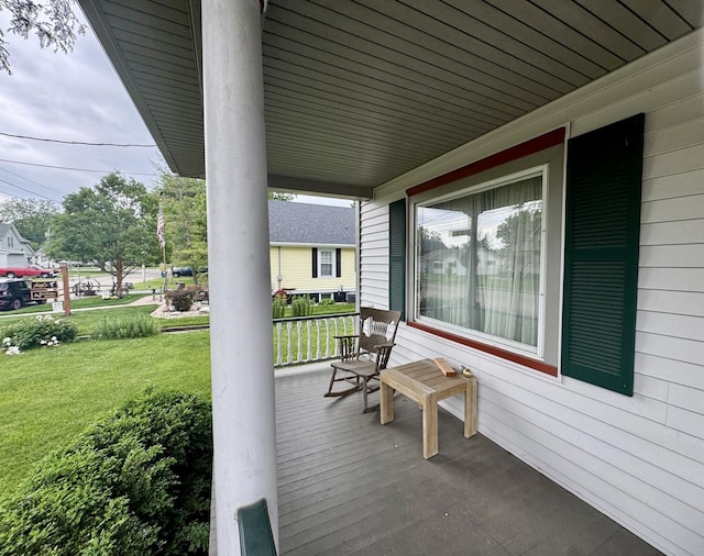 236 S Randolph St, Princeton, IL 61356 - wooden porch featuring a yard