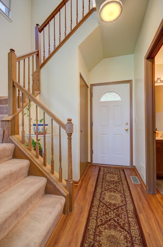 14005 Danbury Dr, Plainfield, IL 60544 - entryway with wood finished floors, stairs, and lofted ceiling