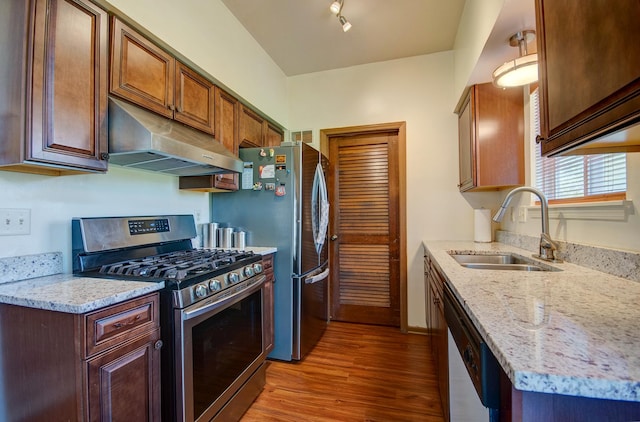 14005 Danbury Dr, Plainfield, IL 60544 - kitchen with under cabinet range hood, stainless steel appliances, light wood-style flooring, and light stone countertops