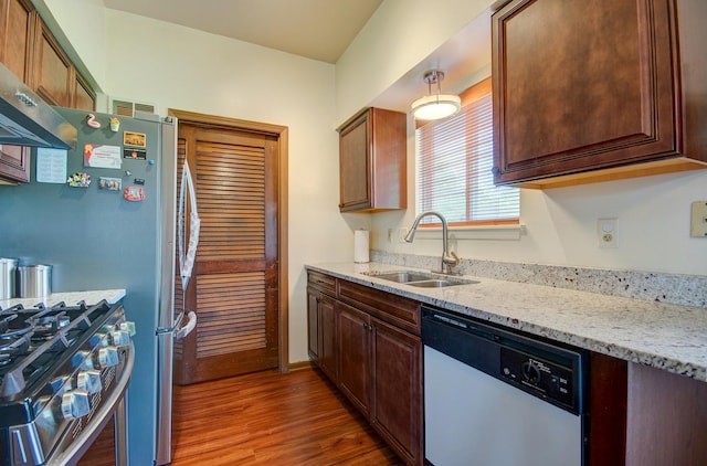 14005 Danbury Dr, Plainfield, IL 60544 - kitchen with dishwashing machine, wood finished floors, light stone countertops, and gas stove