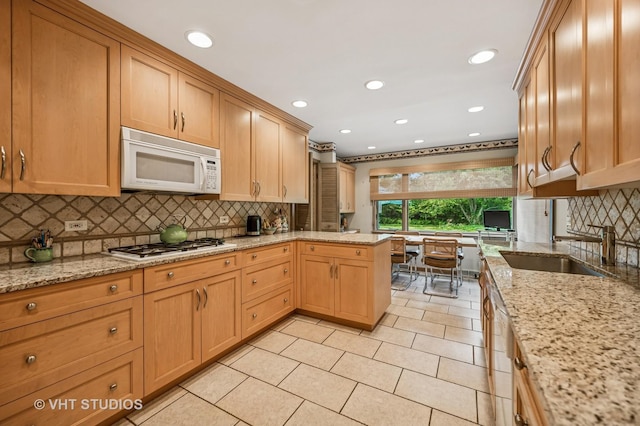 2620 Marian Ln, Wilmette, IL 60091 - kitchen with white appliances, backsplash, light tile patterned floors, recessed lighting, and light stone countertops