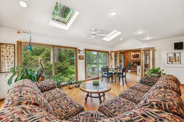 2620 Marian Ln, Wilmette, IL 60091 - living area with a skylight, lofted ceiling, wood finished floors, recessed lighting, and ceiling fan