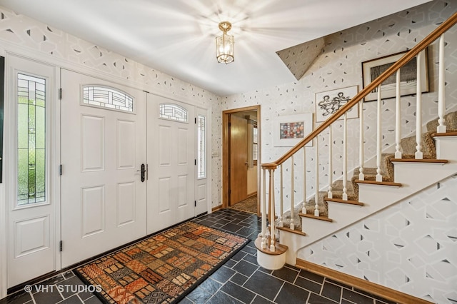 2620 Marian Ln, Wilmette, IL 60091 - foyer entrance with healthy amount of natural light, wallpapered walls, and stairway