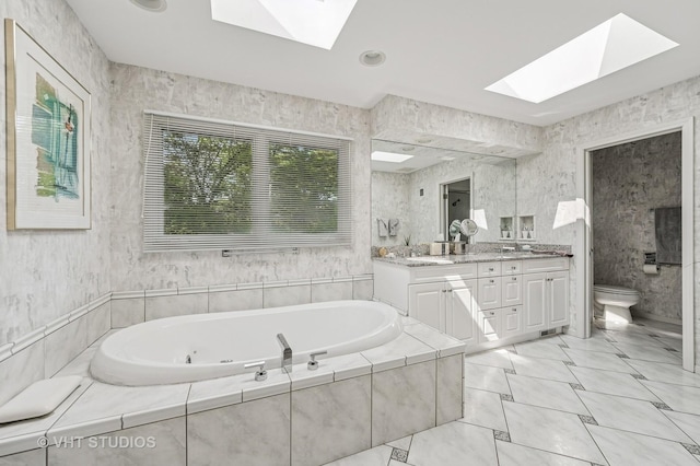 2620 Marian Ln, Wilmette, IL 60091 - full bathroom featuring a skylight, double vanity, and a whirlpool tub