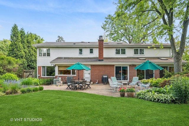 2620 Marian Ln, Wilmette, IL 60091 - rear view of property featuring brick siding and a patio area