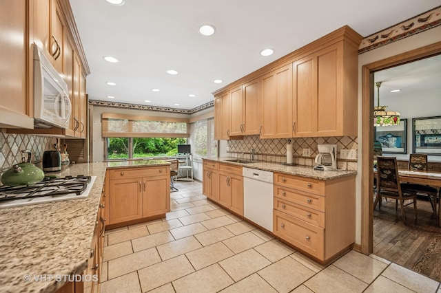 2620 Marian Ln, Wilmette, IL 60091 - kitchen with white appliances, tasteful backsplash, light tile patterned floors, recessed lighting, and light stone counters