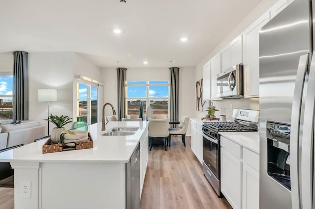 4201 High Point Ct, Joliet, IL 60436 - kitchen featuring stainless steel appliances, a sink, recessed lighting, light wood-type flooring, and white cabinets