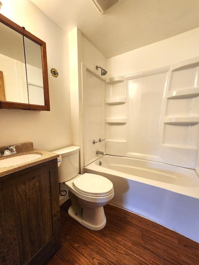 1198 E Bluff St, Marseilles, IL 61341 - full bathroom with wood finished floors, toilet, vanity, and  shower combination