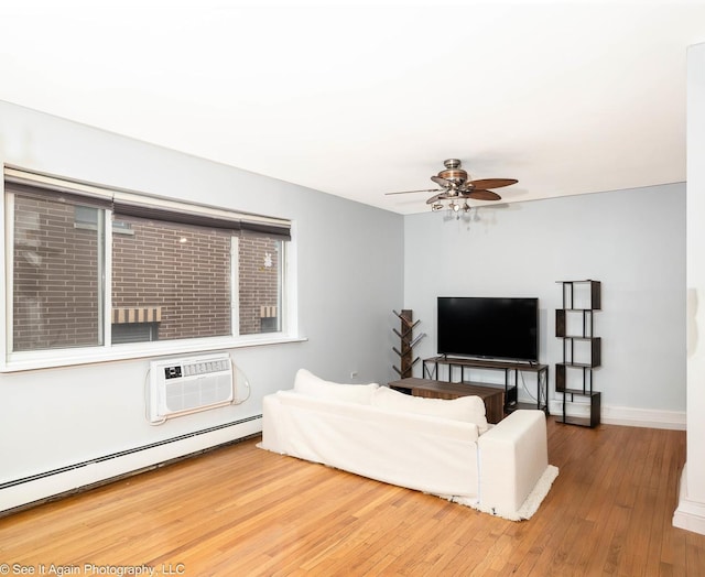 417 S Kenilworth Ave Unit 7, Oak Park, IL 60302 - living area featuring a baseboard radiator, an AC wall unit, ceiling fan, and wood-type flooring