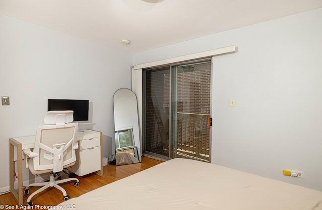 417 S Kenilworth Ave Unit 7, Oak Park, IL 60302 - bedroom with wood finished floors, access to outside, and a desk