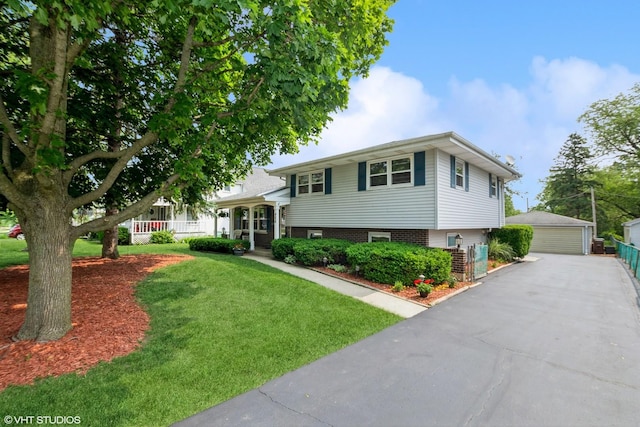 408 S Cedar Rd, New Lenox, IL 60451 - split level home featuring a garage, an outdoor structure, covered porch, and a front lawn