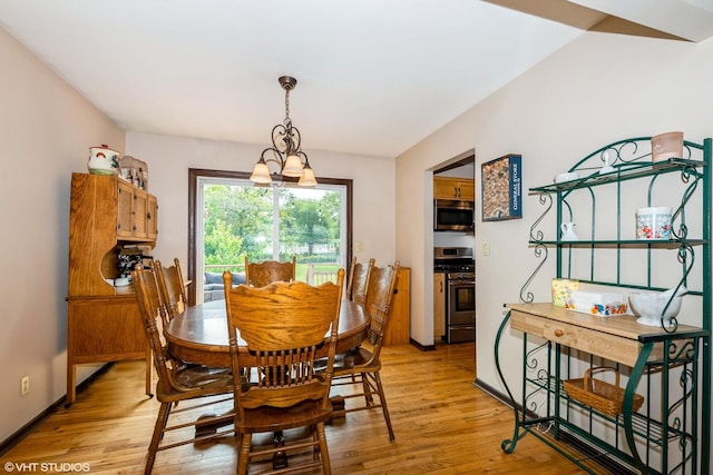 408 S Cedar Rd, New Lenox, IL 60451 - dining area featuring light wood-style floors and a chandelier