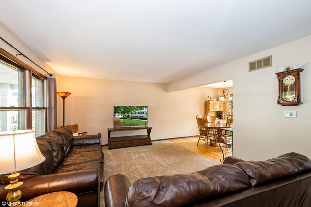 408 S Cedar Rd, New Lenox, IL 60451 - living area with wood finished floors and a chandelier