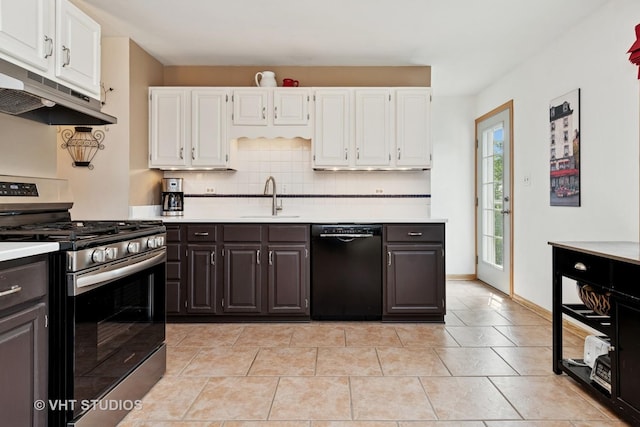 735 Rolling Dr, Lisle, IL 60532 - kitchen with stainless steel gas range oven, black dishwasher, under cabinet range hood, white cabinetry, and light countertops