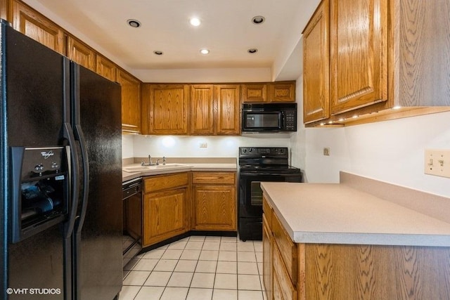 6700 S Brainard Ave Unit 104, Countryside, IL 60525 - kitchen featuring black appliances, brown cabinetry, light tile patterned floors, recessed lighting, and light countertops