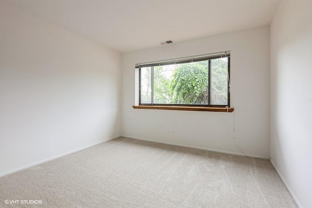 6700 S Brainard Ave Unit 104, Countryside, IL 60525 - unfurnished room featuring light colored carpet and baseboards