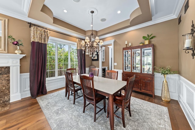 655 Thornwood Dr, Naperville, IL 60540 - dining area featuring a chandelier, dark wood finished floors, a wainscoted wall, crown molding, and a tray ceiling