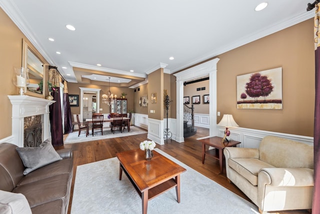 655 Thornwood Dr, Naperville, IL 60540 - living room featuring ornamental molding, recessed lighting, dark wood-style flooring, wainscoting, and a chandelier