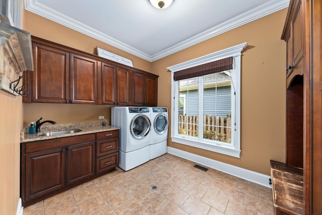 655 Thornwood Dr, Naperville, IL 60540 - washroom featuring cabinet space, washing machine and clothes dryer, crown molding, and baseboards