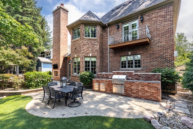 655 Thornwood Dr, Naperville, IL 60540 - rear view of property with brick siding, an outdoor kitchen, a patio, and a chimney