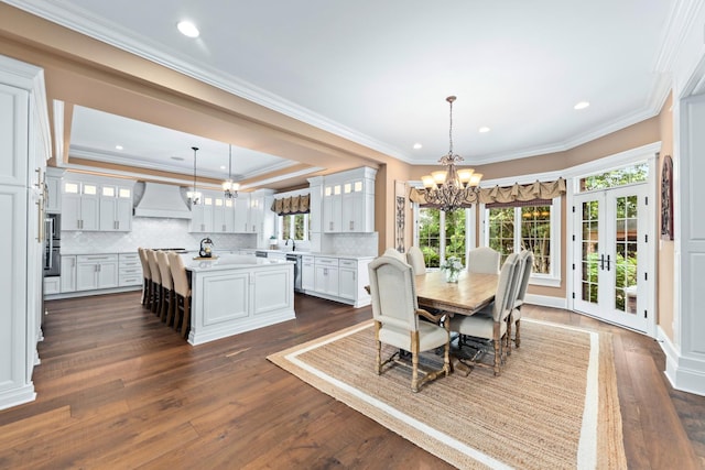 655 Thornwood Dr, Naperville, IL 60540 - dining area featuring a chandelier, crown molding, dark wood-style flooring, a tray ceiling, and recessed lighting