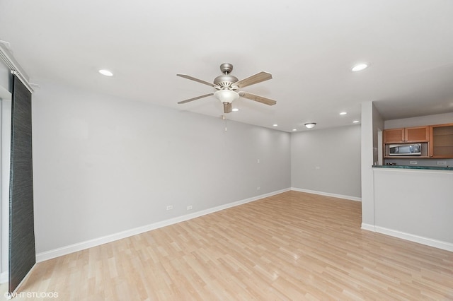 5600 Astor Ln Unit 301, Rolling Meadows, IL 60008 - unfurnished living room featuring light wood-type flooring, baseboards, ceiling fan, and recessed lighting