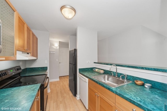 5600 Astor Ln Unit 301, Rolling Meadows, IL 60008 - kitchen with black appliances, a sink, light wood-style flooring, under cabinet range hood, and dark countertops