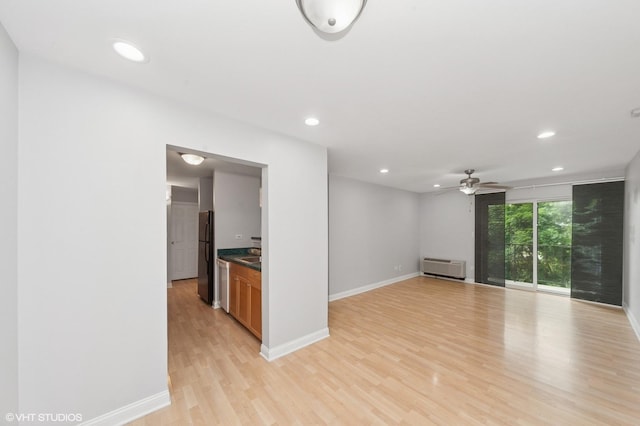5600 Astor Ln Unit 301, Rolling Meadows, IL 60008 - unfurnished room featuring baseboards, light wood-style floors, ceiling fan, recessed lighting, and a wall mounted AC