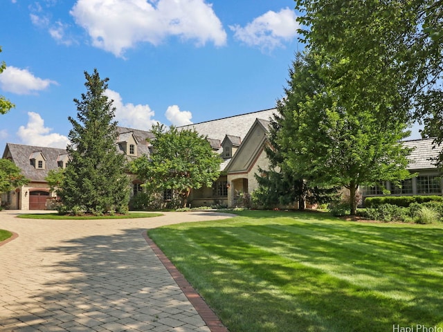 273 Donlea Rd, Barrington Hills, IL 60010 - view of front of house featuring stone siding, a front yard, and a high end roof