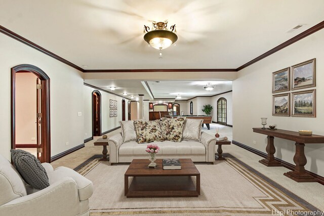 273 Donlea Rd, Barrington Hills, IL 60010 - living area with light carpet, arched walkways, baseboards, and crown molding