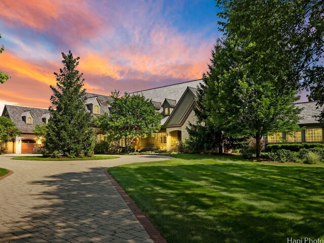 273 Donlea Rd, Barrington Hills, IL 60010 - tudor house with a front yard, a high end roof, and stone siding