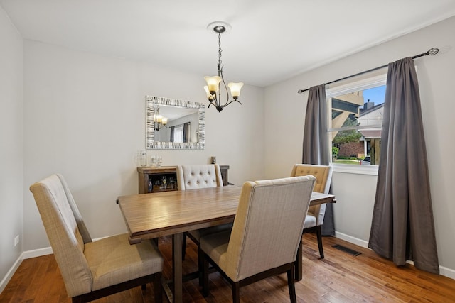 830 E Hillside Ave Unit 830, Barrington, IL 60010 - dining room featuring a chandelier and wood finished floors