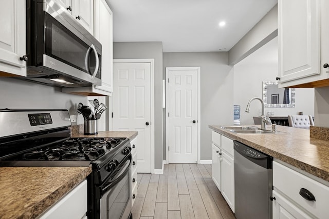 830 E Hillside Ave Unit 830, Barrington, IL 60010 - kitchen featuring stainless steel appliances, white cabinets, and light wood-type flooring