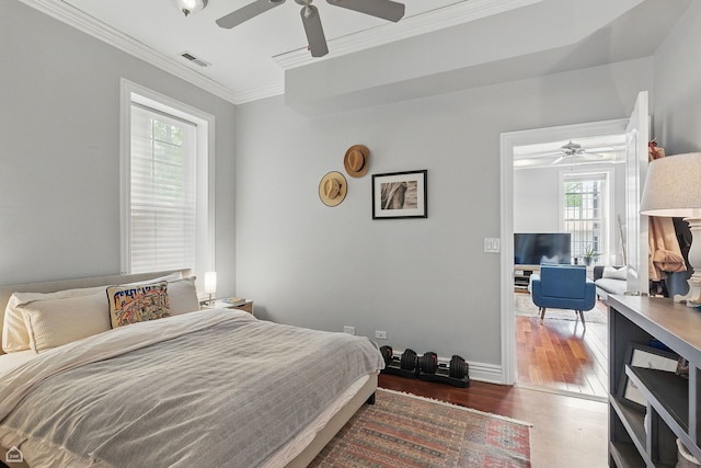 2212 N Campbell Ave Unit 1D, Chicago, IL 60647 - bedroom with wood finished floors, crown molding, ceiling fan, and baseboards