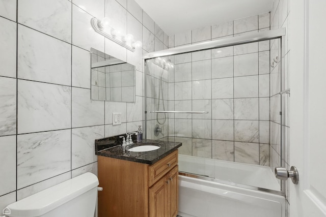 2212 N Campbell Ave Unit 1D, Chicago, IL 60647 - bathroom featuring tile walls, vanity, toilet, and enclosed tub / shower combo