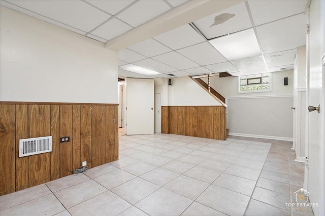 1176 S Maple Ave, Oak Park, IL 60304 - basement with wooden walls, a wainscoted wall, a paneled ceiling, and stairs
