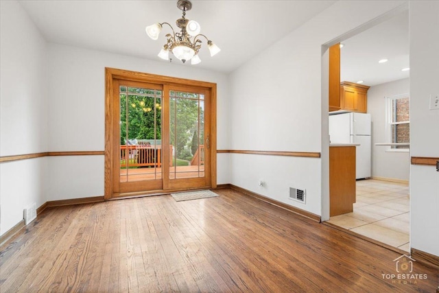 1176 S Maple Ave, Oak Park, IL 60304 - spare room featuring a chandelier, light wood-style floors, baseboards, and recessed lighting