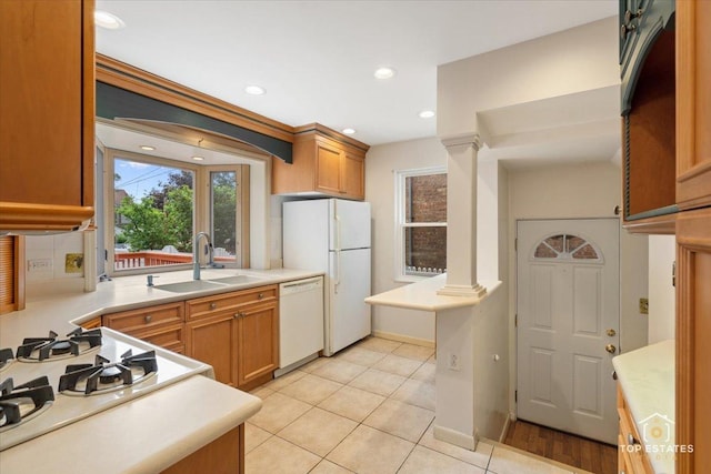 1176 S Maple Ave, Oak Park, IL 60304 - kitchen with a sink, white appliances, ornate columns, light countertops, and recessed lighting