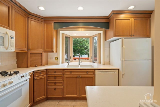 1176 S Maple Ave, Oak Park, IL 60304 - kitchen featuring white appliances, a sink, brown cabinets, light countertops, and recessed lighting