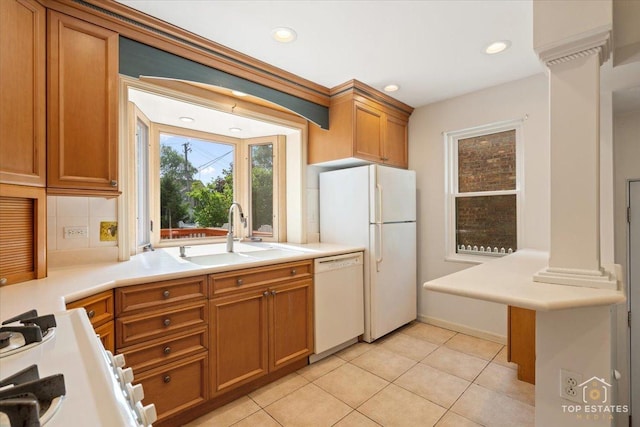 1176 S Maple Ave, Oak Park, IL 60304 - kitchen featuring white appliances, a sink, backsplash, brown cabinets, and light countertops