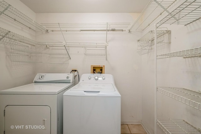 1949 N Charter Point Dr Unit 0, Arlington Heights, IL 60004 - laundry area featuring washing machine and dryer and light tile patterned floors