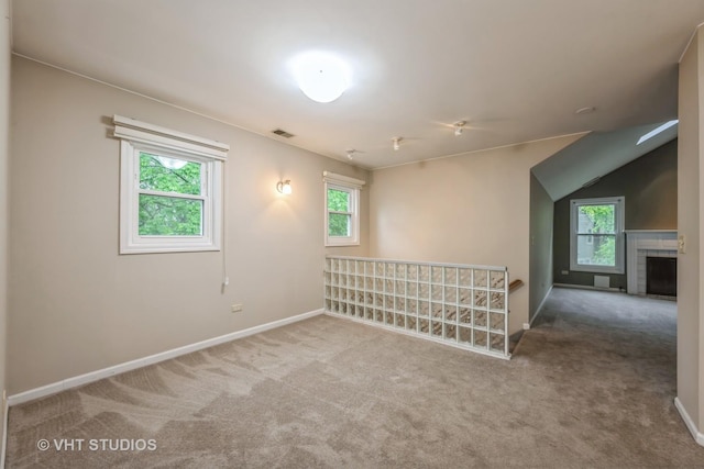 1949 N Charter Point Dr Unit 0, Arlington Heights, IL 60004 - carpeted empty room featuring healthy amount of natural light, baseboards, and a fireplace