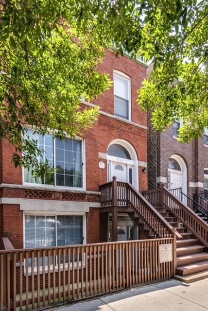 2023 W Armitage Ave, Chicago, IL 60647 - view of property featuring brick siding and stairway