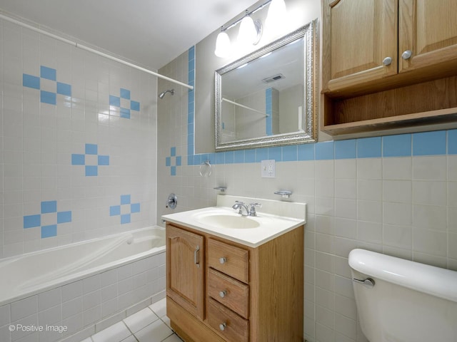 2023 W Armitage Ave, Chicago, IL 60647 - full bath featuring tile walls, tiled shower / bath, vanity, and tile patterned flooring