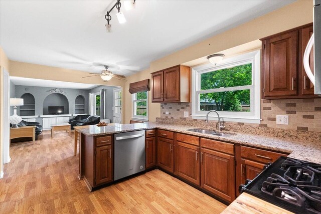 391 Northgate Rd, Lindenhurst, IL 60046 - kitchen featuring stainless steel dishwasher, a sink, light wood-style floors, and open floor plan