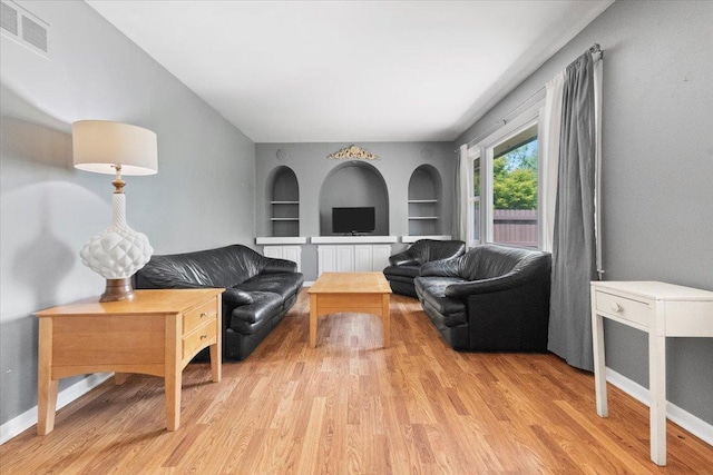 391 Northgate Rd, Lindenhurst, IL 60046 - living room featuring built in features, light wood-style floors, and baseboards